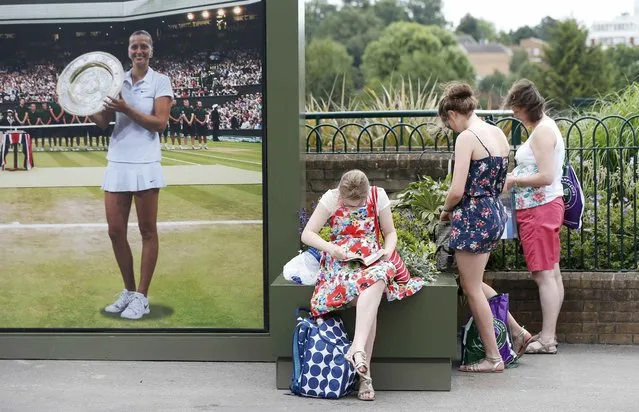 Fans at the Wimbledon Tennis Championships in London, July 1, 2015. (Photo by Suzanne Plunkett/Reuters)