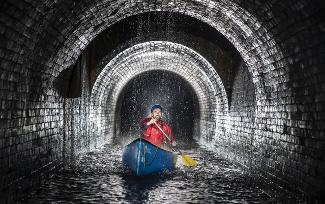 Canal & River Trust team leader Gordon McMinn on Monday, June 10, 2024, canoes through Standedge Tunnel on the Huddersfield Narrow Canal, described as one of the seven wonders of Britain's waterways, the tunnel is nearly three and a half miles long, took more than 17 years to dig by hand and was completed in 1811, becoming the UK's longest, deepest and highest canal tunnel at 645 feet above sea level, burrowing some 638 feet underneath the Pennines. (Photo by Danny Lawson/PA Images via Getty Images)