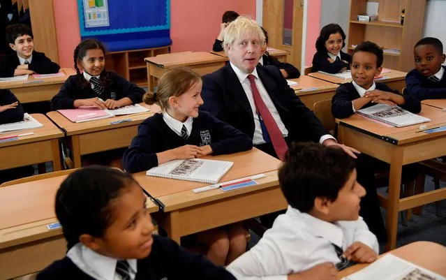 Britain's Prime Minister Boris Johnson attends a year six history class with pupils during a visit to Pimlico Primary school in London, Britain, September 10, 2019. (Photo by Toby Melville/Pool via Reuters)