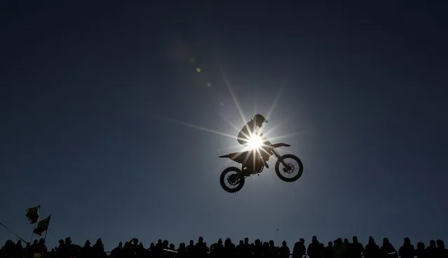 Riders compete in the EMX125 event during the motorcross MXGP of Great Britain at Matterley Basin in Winchester, southern England on February 27, 2022. (Photo by Adrian Dennis/AFP Photo)