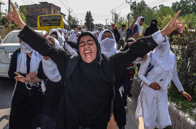 Kashmiri students chant anti-Indian slogans after an attack by Indian government forces on students, during the fourth consecutive day of protests on April 20, 2017 in Srinagar, the summer capital of Indian administered Kashmir, India. Hundreds of Kashmir students took to the streets to protest a police raid in a college in southern Pulwama town on last week, in which at least 50 students were injured. The students were chanting slogans “Go India, go back” and “We want freedom”. Indian government forces used tear gas to disperse the students , who were protesting against the alleged attack by Indian forces on college students in south Kashmir. The authorities also suspended internet services in the region. (Photo by Yawar Nazir/Getty Images)