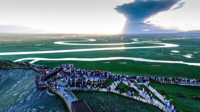Tourists are flocking to the Bayanbulak scenic spot in Bayingoleng Mongolian Autonomous Prefecture, in Xinjiang, China, on June 29, 2024. (Photo by Costfoto/NurPhoto/Rex Features/Shutterstock)