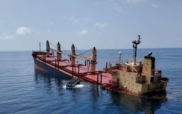 The M/V Rubymar, a Belize-flagged, UK-registered, Lebanese-owned cargo ship that was struck last month by ballistic missiles fired from Houthi territory in Yemen, sinks in the Red Sea on Sunday, March 3, 2024. The damage sustained by the Rubymar is potentially the most significant to a vessel caused by an attack launched by the Houthis, who have been targeting commercial shipping in the Red Sea and Gulf of Aden for months. (Photo by Al-Joumhouria TV/Getty Images)