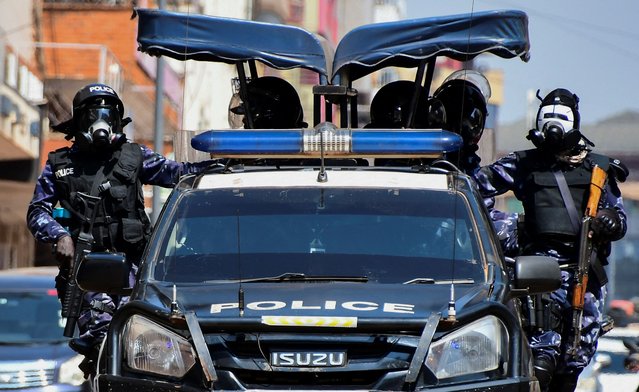 Riot police officers patrol the streets during a rally against what the protesters say are rampant corruption and human rights abuses by the country's rulers in Kampala, Uganda on July 23, 2024. (Photo by Michael Muhati/Reuters)