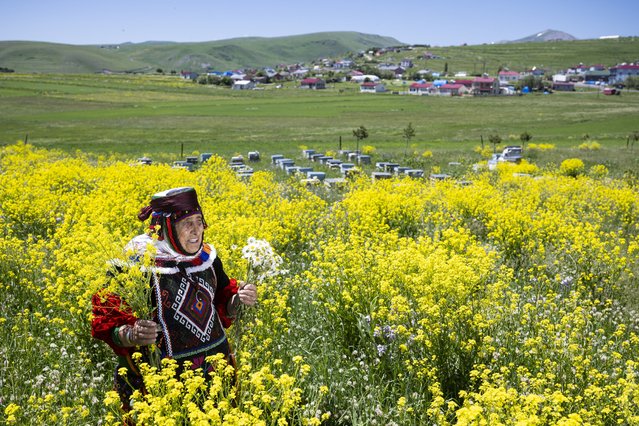 Flowers blooming in Damal district of Turkiye's Ardahan are viewed on June 22, 2024. Residents of the district and visitors take photos among the flowers wearing Damal Local Clothes. Damal district offers beautiful landscapes to its visitors in every season. Due to its high altitude and harsh climate, the flowers blooming in the region, where spring comes late, add color to nature. (Photo by Ismail Kaplan/Anadolu via Getty Images)