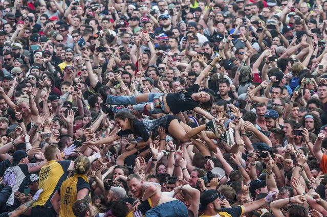 Festival goers crowd surf at Rock On The Range Music Festival on Saturday, May 20, 2017, in Columbus, Ohio. (Photo by Amy Harris/Invision/AP Photo)