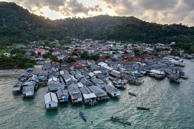 This aerial picture shows a traditional fishing village at Rangai Tri Tunggal village, in Lampung province on July 24, 2024. (Photo by Bay Ismoyo/AFP Photo)