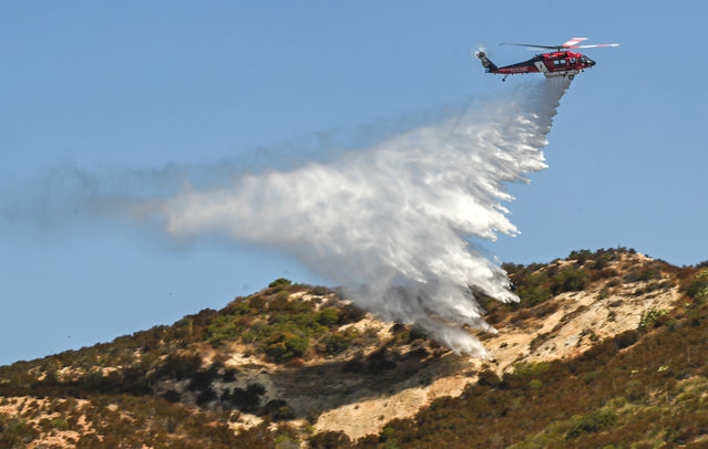 The Orange County fire authority demonstrates its new S70 Firehawk helicopter during a media event in Silverado, California on August 19, 2024. (Photo by Jeff Gritchen/AP Photo)