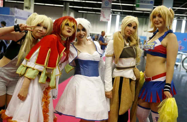 Cosplayers pose for a photo during the Gamescom 2015 fair in Cologne, Germany August 6, 2015. (Photo by Kai Pfaffenbach/Reuters)