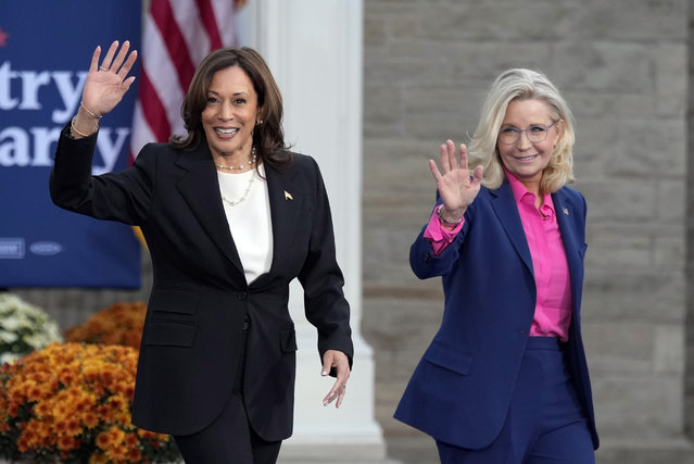 Democratic presidential nominee Vice President Kamala Harris walks with former Rep. Liz Cheney, R-Wyo., at a campaign rally at Ripon College, Thursday, October 3, 2024, in Ripon, Wis. (Photo by Charlie Neibergall/AP Photo)