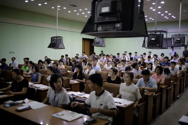 North Korean men and women attend a Chinese language class at the Grand People's Study House on Monday, July 24, 2017, in Pyongyang, North Korea. The building is situated on Kim Il Sung Square and serves as the central library where North Koreans also go to for language classes such as English, Chinese, German and Japanese. (Photo by Wong Maye-E/AP Photo)