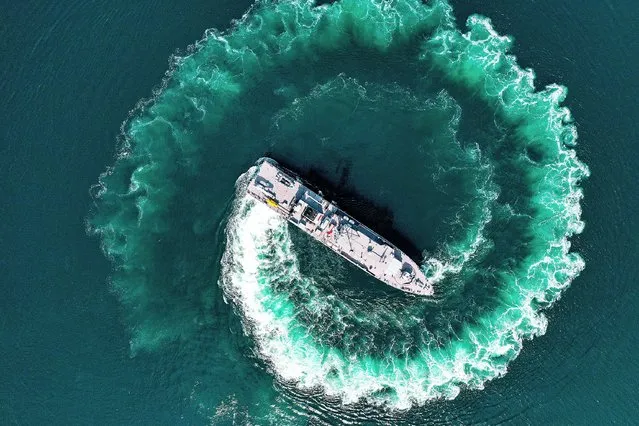 An aerial view of Turkish Navyâs minesweeper ship belonging to Turkish Navy Mine Squadron Command is seen as Turkish Navy Mine Squadron Command is always standing by against the threat of mines drifting in the Black Sea due to the Russia-Ukraine war on June 14, 2022 in Erdek district of Balikesir, Turkiye. Turkish Navy Mine Squadron Command performs important tasks in the detection and destruction of sea mines, which can be a major threat to maritime transport. Turkish Naval Forces' Mine Squadron Command components seek, detect and destroy the naval mines for keeping the seas secure and clean. (Photo by Ali Atmaca/Anadolu Agency via Getty Images)