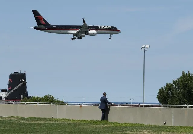A U.S. Secret Service agent watches as a private jet carrying Republican U.S. presidential candidate Donald Trump arrives on the third day of the Republican National Convention in Cleveland, Ohio, U.S., July 20, 2016. (Photo by Jonathan Ernst/Reuters)