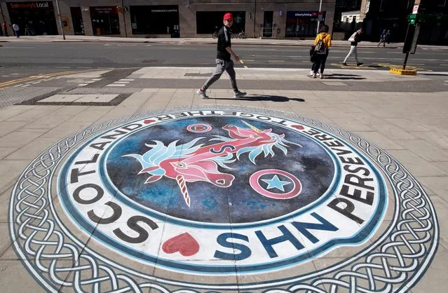 Pavement artwork by Canadian artist Victor Fraser shows support for the NHS in Scotland on Leith Walk, Edinburgh on May 6, 2020, as the UK continues in lockdown to help curb the spread of the coronavirus. (Photo by Jane Barlow/PA Images via Getty Images)