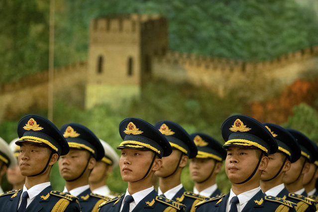 Members of a Chinese honor guard stand at attention during a welcome ceremony for Myanmar's State Counselor Aung San Suu Kyi at the Great Hall of the People in Beijing, Thursday, August 18, 2016. (Photo by Mark Schiefelbein/AP Photo)