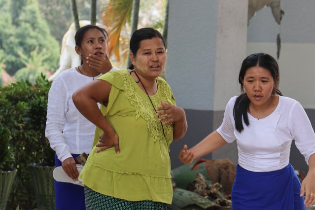 Women react outside the National Museum in Naypyidaw on March 28, 2025, after an earthquake in central Myanmar. A powerful earthquake hit Myanmar and neighbouring Thailand on March 28, turning a major hospital in the Burmese capital into a “mass casualty area” and trapping dozens of workers in an under-construction skyscraper in Bangkok. (Photo by Sebastien Berger/AFP Photo)