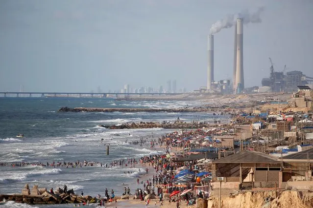 People enjoy the beach as Palestinians ease the coronavirus disease (COVID-19) restrictions, in the northern Gaza Strip on May 29, 2020. (Photo by Mohammed Salem/Reuters)