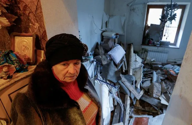 Local resident Lyudmila, 70, shows her apartment inside a house heavily damaged in recent shelling in the course of Russia-Ukraine conflict in Donetsk, Russian-controlled Ukraine on December 6, 2022. (Photo by Alexander Ermochenko/Reuters)