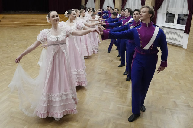 Dancers of the WARSZAWIANKA ensemble of the University of Warsaw dance Poland's national polonaise dance in 18th century costumes during dress rehearsal in Warsaw, Poland, on February 8, 2024. Once banned by rulers dispatched from Moscow, Poland's stately polonaise dance that nurtured the country's spirit even through the dark years of its partition is now honored by the United Nations' education and culture agency, UNESCO. (Photo by Czarek Sokolowski/AP Photo)