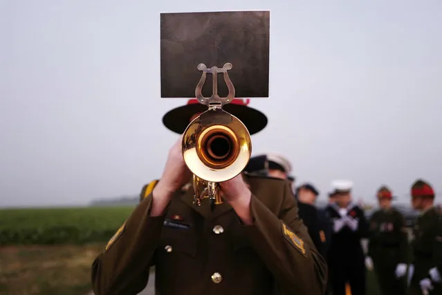 New Zealand officers stand before a ceremony to commemorate the 100th anniversary of the Battle of the Somme in the New Zealand Battlefield Memorial in Longueval, northern France, Thursday, September 15, 2016. More than 1 million people were killed, wounded or went missing in the Battle of the Somme in northern France, pitting British, New Zealand and French troops against German ones from July 1 to Nov. 18, 1916. (Photo by Michel Spingler/AP Photo)