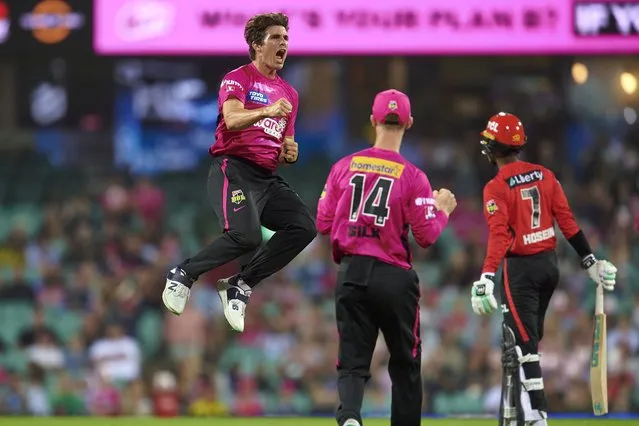 Sean Abbott of the Sixers celebrates after taking the wicket of Akeal Hosein of the Renegades during the Men's Big Bash League match between the Sydney Sixers and the Melbourne Renegades at Sydney Cricket Ground, on December 28, 2022, in Sydney, Australia. (Photo by Brett Hemmings/Getty Images)