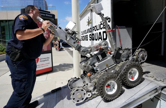 A Cleveland police bomb squad technician loads a Remotec F5A explosive ordnance device robot during a demonstration of police capabilities near the site of the Republican National Convention in Cleveland, Ohio, U.S. July 14, 2016. (Photo by Rick Wilking/Reuters)