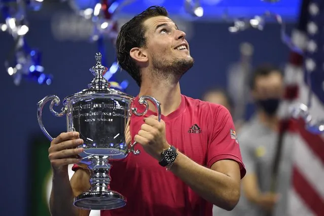 Dominic Thiem of Austria celebrates with championship trophy after winning in a tie-breaker during his Men's Singles final match against Alexander Zverev of Germany on Day Fourteen of the 2020 US Open at the USTA Billie Jean King National Tennis Center on September 13, 2020 in the Queens borough of New York City. (Photo by Danielle Parhizkaran/USA TODAY Sports)