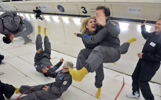 Civilian passengers of the Airbus A330 Zero-G, who are not astronauts nor scientists, enjoy the weightlessness, on March 15, 2013, during the first zero gravity flight for paying passengers in Europe. All boarding cards, costing 6,000 euros, were sold for the years 2013 and 2014. (Photo by Mehdi Fedouach/AFP Photo)