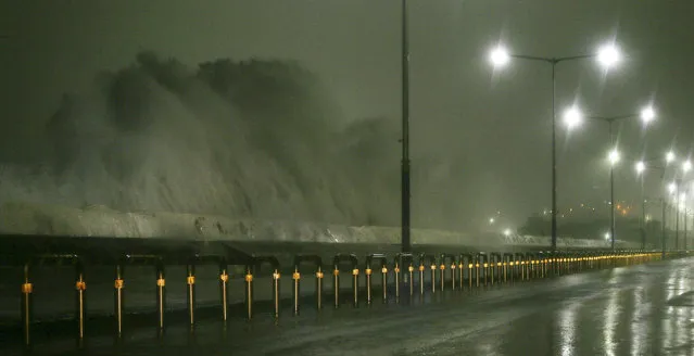 High waves rise over a road as Typhoon Chaba approaches Jeju Island, South Korea, 05 October 2016. (Photo by EPA/Yonhap)