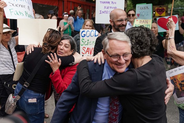 Employees at the Centers for Disease Control and Prevention bid farewell to top officials as they were escorted out of the agency’s main office in Atlanta on Thursday, August 28, 2025. The officials resigned their positions after the ouster of the agency’s director, Dr. Susan Monarez. (Photo by Elijah Nouvelage/Getty Images)