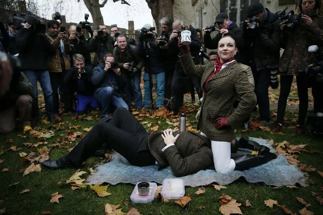 Protesters take part in a demonstration against new laws on p*rnography outside parliament in central London December 12, 2014. (Photo by Stefan Wermuth/Reuters)