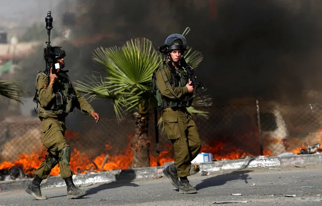 Israeli soldiers are seen during clashes with Palestinian protesters in the West Bank town of Al-Ram, near Jerusalem October 9, 2016. (Photo by Mohamad Torokman/Reuters)