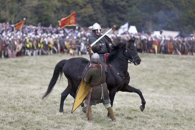 Re-enactors participate in a re-enactment of the Battle of Hastings, commemorating the 950th anniversary of the battle, in Battle, Britain October 15, 2016. (Photo by Neil Hall/Reuters)