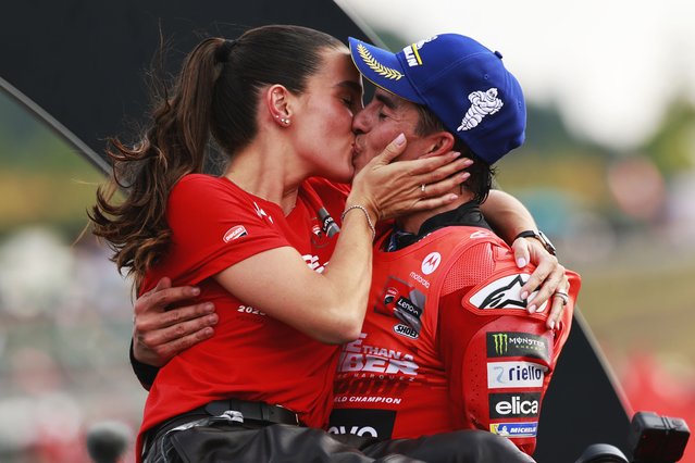 MotoGP Ducati Lenovo Team rider Marc Marquez (R) of Spain kisses his girlfriend Gemma Pinto (L) as he celebrates his World Champion 2025 title after the race at the Motorcycling Grand Prix of Japan in Motegi, Tochigi Prefecture, northeastern Japan, 28 September 2025. (Photo by Franck Robichon/EPA)