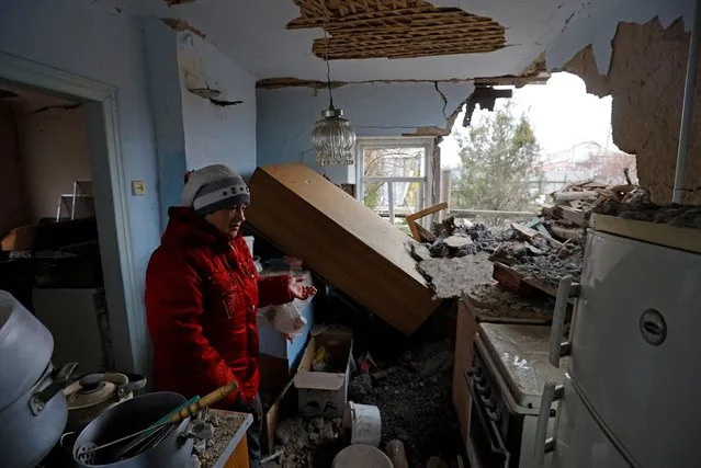 Local resident Galina Slepko, 64, stands inside her house which was heavily damaged in recent shelling during Russia-Ukraine conflict, in Horlivka (Gorlovka) in the Donetsk region, Russian-controlled Ukraine on April 3, 2023. (Photo by Alexander Ermochenko/Reuters)
