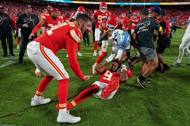 The Detroit Lions’ Brian Branch, in white, fights with Kansas City Chiefs wide receiver JuJu Smith-Schuster after the Chiefs’ win on Sunday, October 12, 2025. Branch apologized for his actions and said that he reacted the way he did because Smith-Schuster had hit him in the back late in the game, which he thought was illegal. The NFL suspended Branch one game without pay for unsportsmanlike conduct. (Photo by Ed Zurga/AP Photo)