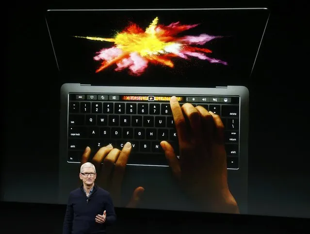 Apple CEO Tim Cook speaks under a graphic of the new MacBook Pro during an Apple media event in Cupertino, California, U.S. October 27, 2016. (Photo by Beck Diefenbach/Reuters)