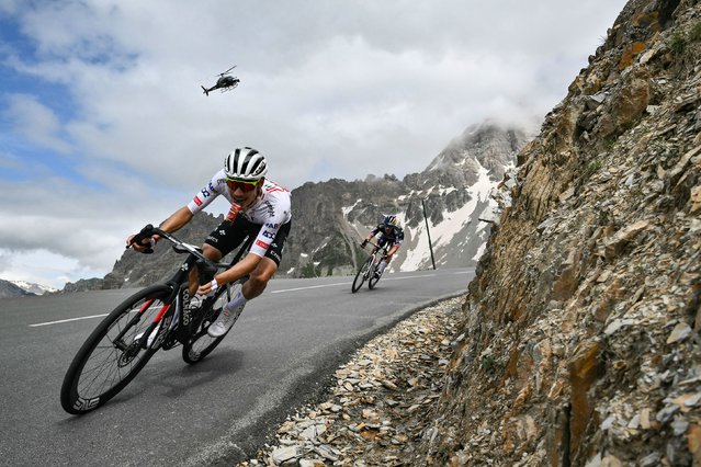 Cyclists João Almeida, left, and Primož Roglič compete in the fourth stage of the Tour de France, which ran from Pinerolo, Italy, to Valloire, France, on Tuesday, July 2, 2024. (Photo by Marco Bertorello/AFP Photo)