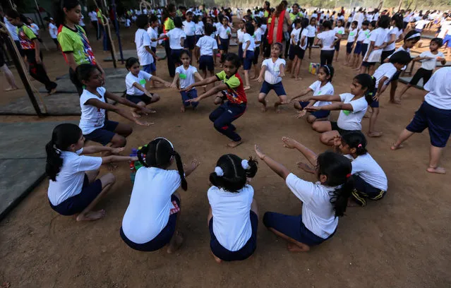 Indian students warm up before a practice of Rope Mallakhamb, during the 44th Samartha Summer Sports Coaching Camp organized by Shree Samarth Vyayam Mandir in Mumbai, India, 20 April 2018. (Photo by Divyakant Solanki/EPA/EFE)
