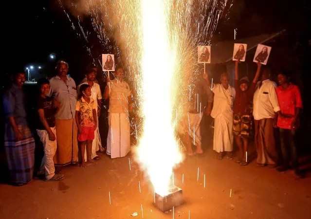 People hold posters of Kamala Harris to celebrate after she was sworn in as U.S. Vice President during the inauguration of Joe Biden as the 46th President of the United States, in the village of Thulasendrapuram, where Harris' maternal grandfather was born and grew up, in Tamil Nadu state, India, January 20, 2021. (Photo by P. Ravikumar/Reuters)