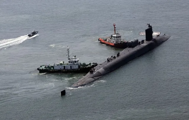 The nuclear-powered submarine USS Michigan approaches a naval base in Busan, South Korea, Friday, June 16, 2023. The United States deployed the nuclear-powered submarine capable of carrying about 150 Tomahawk missiles to South Korea on Friday, a day after North Korea resumed missile tests in protest of the U.S.-South Korean live-fire drills. (Photo by Gang Duck-chul/Yonhap via AP Photo)
