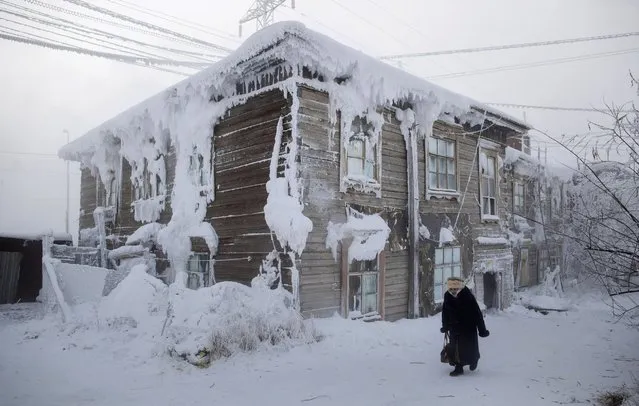A frost-encrusted house in the city center of Yakutsk, Russia, January 2014. (Photo by Amos Chapple/REX Features)