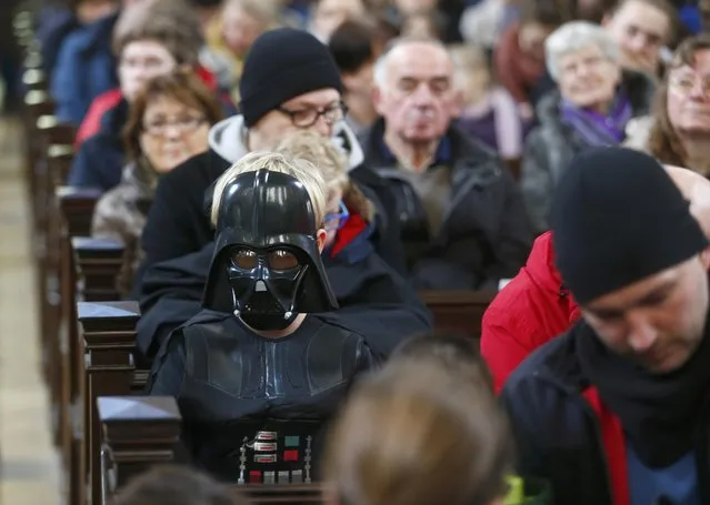 A boy dressed as a character from the movie Star Wars attends a service at the church Zionskirche in Berlin, Germany, December 20, 2015. (Photo by Hannibal Hanschke/Reuters)