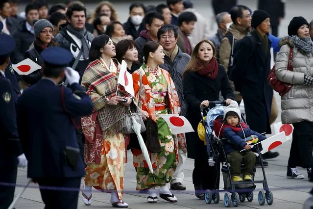People arrive for an appearance by Japan's Emperor Akihito at the Imperial Palace to mark his 82nd birthday in Tokyo, Japan, December 23, 2015. (Photo by Thomas Peter/Reuters)