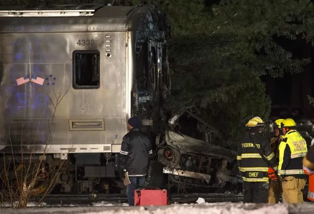 A car sits crushed into the front of a Metropolitan Transportation Authority (MTA) Metro North Railroad commuter train near the town of Valhalla, New York, February 3, 2015.  At least six people died and 12 more were injured on Tuesday evening when the New York commuter train struck at least one car near the town of White Plains, sparking a fire, ABC News reported. (Photo by Mike Segar/Reuters)