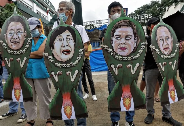 Protesters hold caricatures of (L-R) National Security Adviser Eduardo Ano, Philippine President Ferdinand Marcos Jr., Vice-President Sara Duterte and Defense Secretary Gilberto Teodoro during a rally outside the Armed Forces of the Philippines headquarters in Quezon City, Metro Manila, Philippines, 17 July 2023. One week ahead of the State of the Nation Address of President Ferdinand Marcos Jr., human rights group Karapatan (Rights), called for a stop to alleged counter-insurgency bombing tactics in provinces where innocent lives mainly of farmers, women and children are put at risk due to armed conflict situations. (Photo by Rolex Dela Pena/EPA)