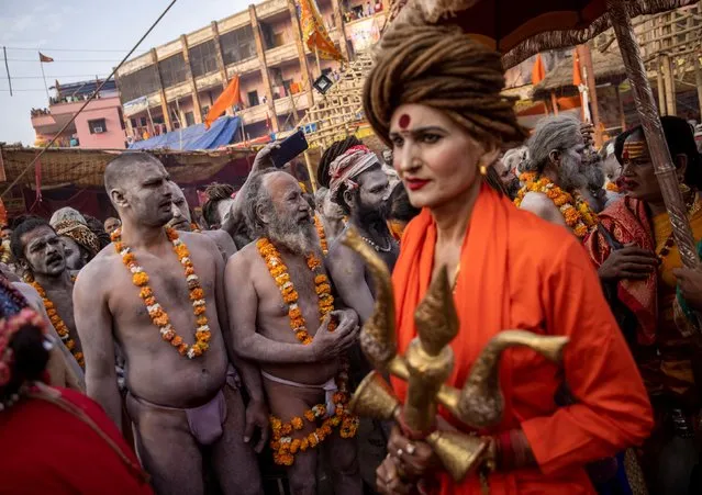 Naga Sadhus, or Hindu holy men, participate in the procession for taking a dip in the Ganges river during Shahi Snan at “Kumbh Mela”, or the Pitcher Festival, in Haridwar, India, April 12, 2021. (Photo by Danish Siddiqui/Reuters)