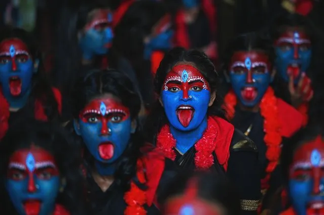 Students dressed as Hindu goddess Kali gather to celebrate the upcoming “Krishna Janmashtami” festival at a college in Mumbai on September 4, 2023. (Photo by Punit Paranjpe/AFP Photo)