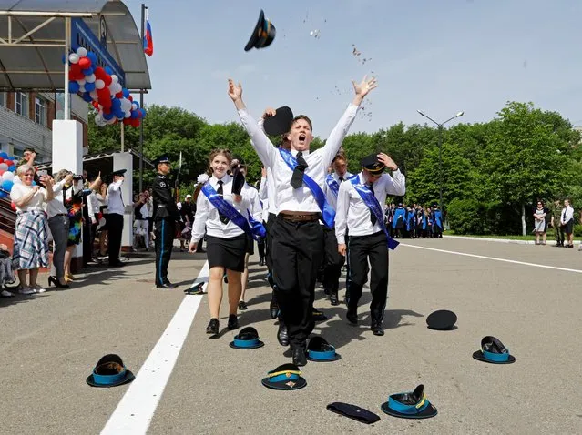 Graduates take part in the Farewell Bell ceremony at the General Yermolov Cadet School in Stavropol, Russia on May 22, 2021. (Photo by Eduard Korniyenko/Reuters)