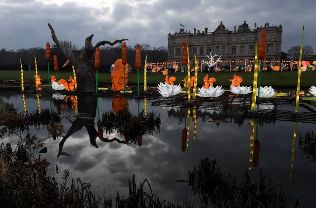 Visitors view lanterns in a seasonal light display at Longleat House, during a Chinese Lantern Festival, near Warminster in south-west Britain, December 20, 2016. (Photo by Toby Melville/Reuters)